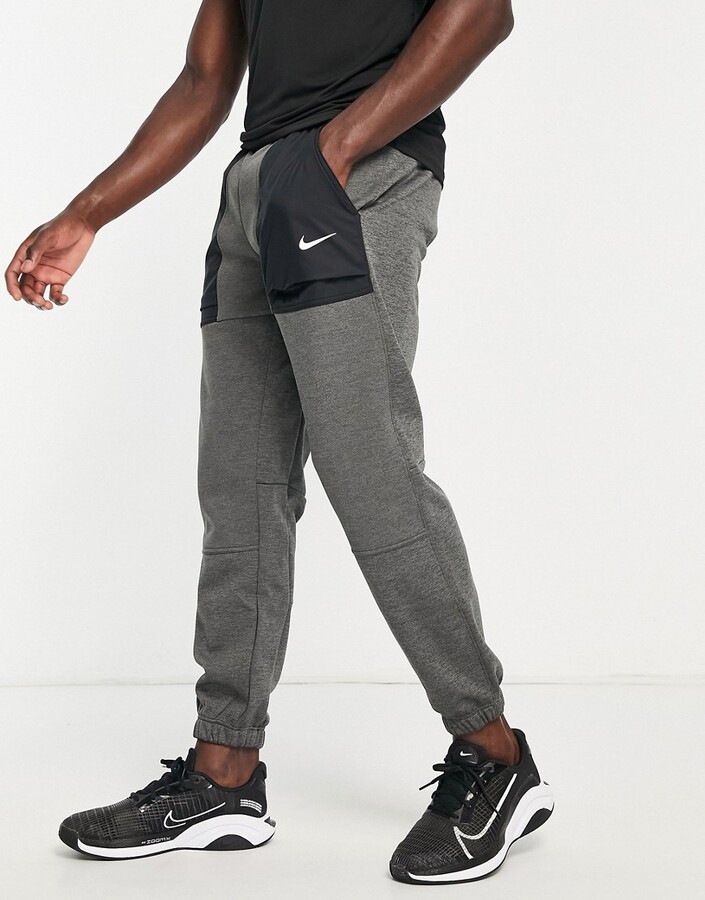 Nike Training Therma-FIT novelty tapered joggers in grey and black -  ShopStyle Trousers