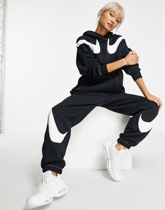 Nike Swoosh fleece in black - ShopStyle Activewear Trousers