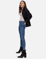 Thumbnail for your product : Topshop Jamie jeans with abraded hem detailing in mid blue