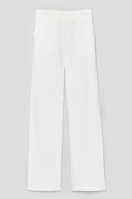 white linen flared trousers