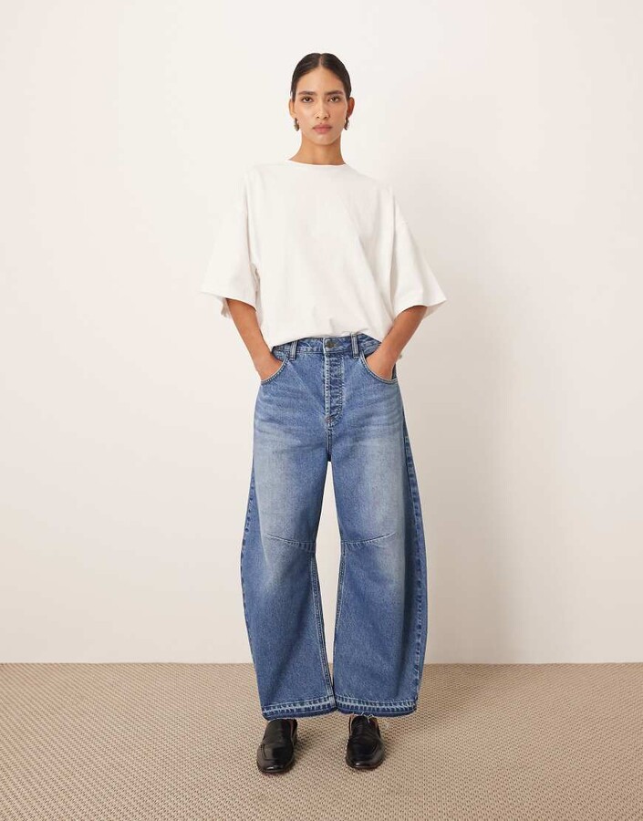 ARRANGE Sydney released hem cropped jeans in mid wash blue