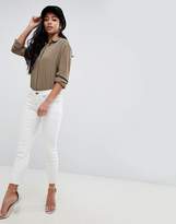 Thumbnail for your product : ASOS Petite DESIGN Petite Whitby low rise jeans in off white with contrast stitching