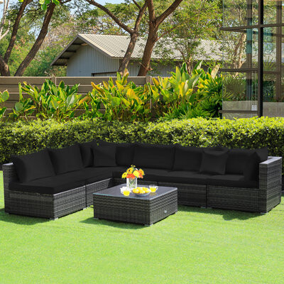 Latitude Run Jodan 7 Piece Rattan Sectional Seating Group with Cushions