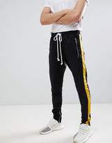 Thumbnail for your product : Criminal Damage Skinny Joggers In Black With Yellow Side Stripe