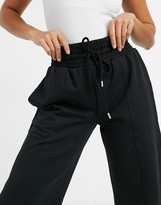 Thumbnail for your product : ASOS Petite DESIGN Petite straight leg jogger with deep waistband and pintuck in organic black
