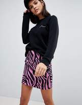 Thumbnail for your product : ASOS DESIGN Denim Mini Skirt in Pink Zebra Print