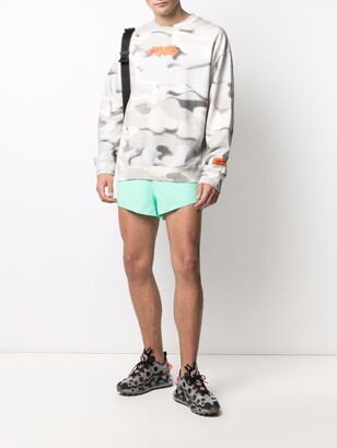 Nike Swoosh print track shorts