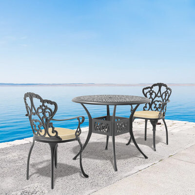 Bloomsbury Market Cast Aluminum Patio Furniture Set - Beige Cushions Weather-resistant Carved Table & Chairs (stackable)