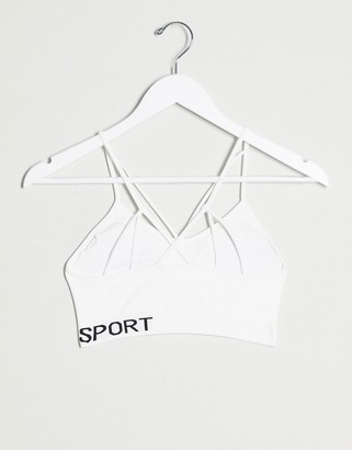 DKNY low impact strappy seamless bra w/ removable cups in white