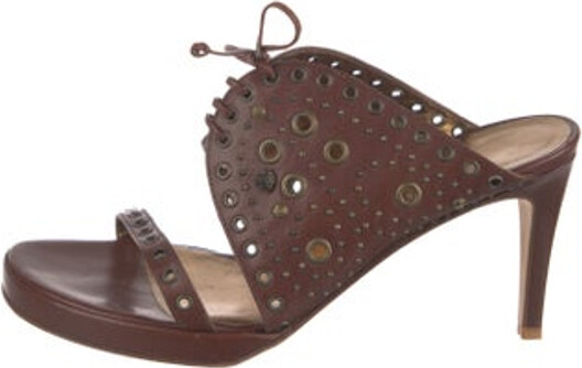 Gianni Versace Leather Slides Brown Medusa Insignia Studded Accents Crossover Straps Unfortunately, due to restrictions, this item may not be eligible for shipping in all areas.