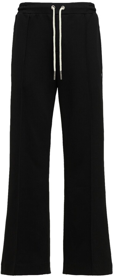 Puma Iconic MCS logo sweatpants in black - ShopStyle Trousers