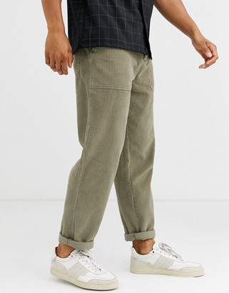 ASOS DESIGN relaxed cord pants with utility pockets in washed khaki