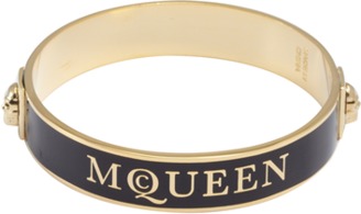 Alexander McQueen black and gold enamel logo skull bangle