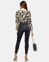 Thumbnail for your product : Topshop Jamie jeans with thigh rip in washed black