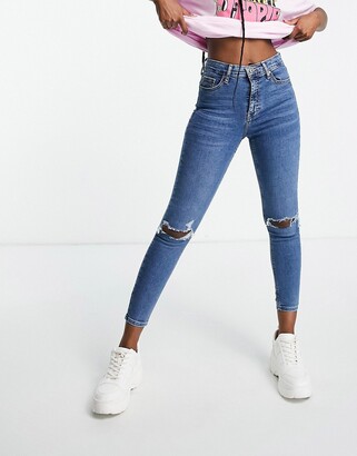 Topshop Jamie jeans with knee rips in mid blue - ShopStyle