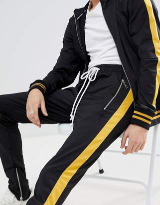 Criminal Damage Skinny Joggers In Black With Yellow Side Stripe