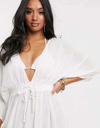 ASOS DESIGN PETITE crinkle beach cover up with channel waist & drape sleeves in white