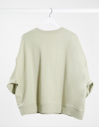 ASOS DESIGN Curve boxy sweatshirt with wide sleeve in olive