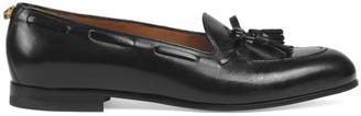 Gucci Suede and lizard tassel loafer