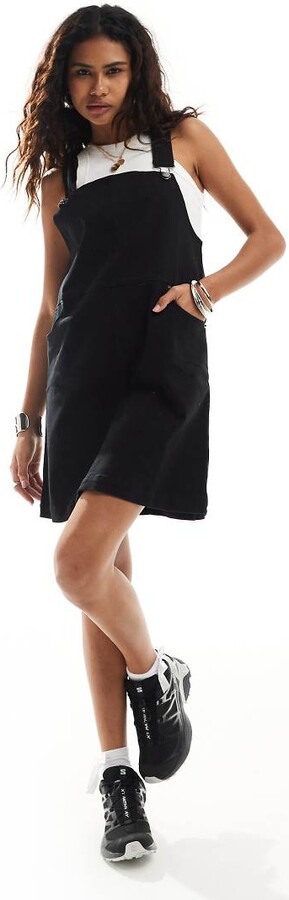 Monki denim mini dungaree dress in black ShopStyle