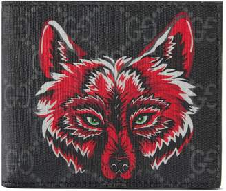 Gucci GG Supreme wallet with wolf