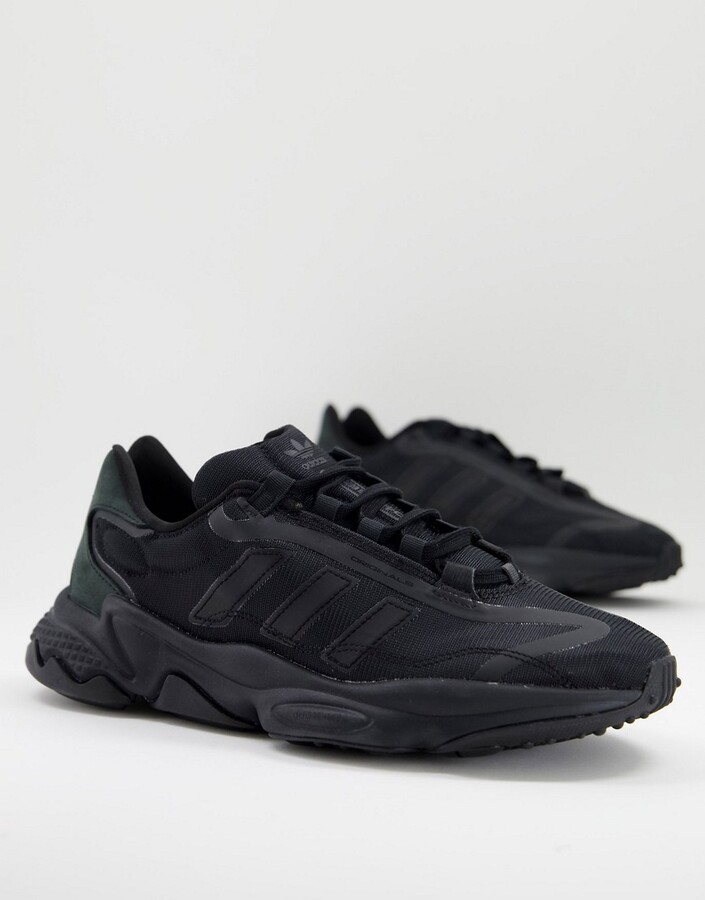 adidas Ozweego Pure sneakers in triple black - ShopStyle