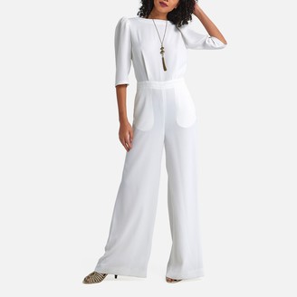 white low back jumpsuit