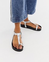 Thumbnail for your product : ASOS Design DESIGN Filmore premium leather minimal footbed toe loop sandals