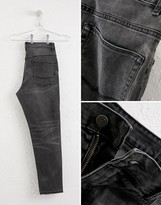 Thumbnail for your product : ASOS DESIGN tapered jeans in vintage washed black
