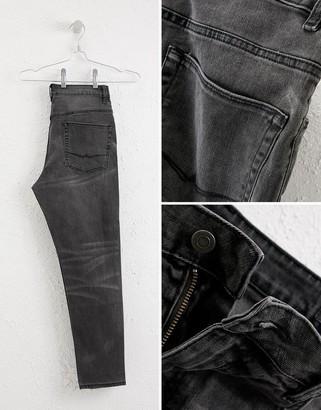 ASOS DESIGN tapered jeans in vintage washed black