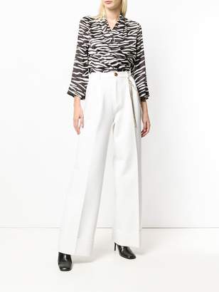 Area embellished chain trousers