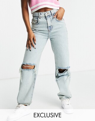 Reclaimed Vintage Inspired 90s dad jeans with extreme rips in antique wash