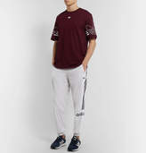 Thumbnail for your product : adidas Tapered Logo-Embroidered Striped Velour Sweatpants