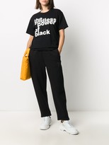 Thumbnail for your product : Black Comme Des Garçons slogan-print cotton T-shirt