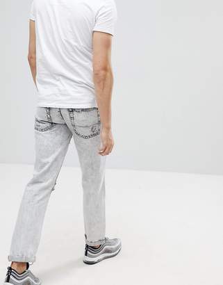 ASOS DESIGN Slim Jeans In Acid wash Gray With Heavy Rips and Check Patches