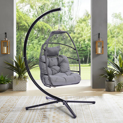 https://img.shopstyle-cdn.com/sim/5c/dc/5cdc352c1427e65192c62bc70ab651ab_best/ling-outdoor-patio-wicker-folding-hanging-chair-rattan-swing-hammock-egg-chair-with-c-type-bracket-with-cushion-and-pillow.jpg