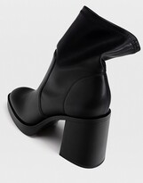Thumbnail for your product : Stradivarius platform heeled ankle sock boots in black