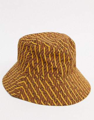 ASOS DESIGN two-piece wide brim bucket hat in brown and orange print