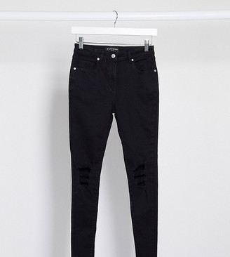 Parisian skinny jeans with ripped knee in black