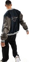 Thumbnail for your product : ASOS DESIGN oversized varsity jacket with faux leather sleeves in navy