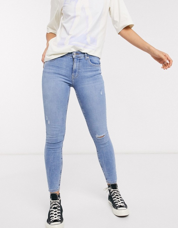 Bershka super skinny 5 pocket jeans in medium blue with knee rip - ShopStyle