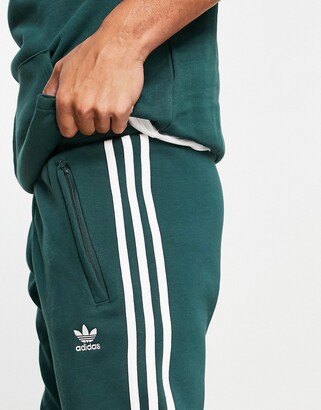adidas Tall adicolor three stripe joggers in green - ShopStyle Trousers