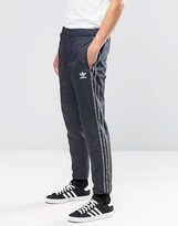 Thumbnail for your product : adidas Mix Logo Joggers In Grey Ay8363