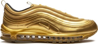 nike gold and black sneakers