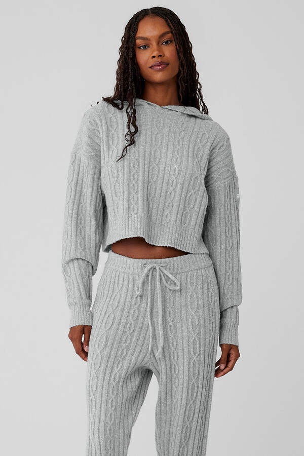 https://img.shopstyle-cdn.com/sim/5f/bb/5fbbbc67df269d130f6d9e8e8522d4ab_best/alo-yoga-cable-knit-winter-bliss-hoodie-in-athletic-heather-grey-size-small.jpg