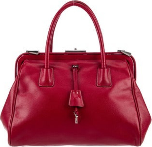 Prada Top Handle Bag Rubino Madras Leather Signature Logo Silver-Tone Hardware Nylon Trim Rolled Handles Logo Jacquard Lining & Single Interior Pocket Push-Lock Closure at Top Protective Feet at Base Includes Authenticity Card Unfortunately due to restrictions this item may not be eligible for shipping in all areas.