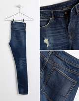 Thumbnail for your product : ASOS DESIGN super skinny jeans in dark wash blue with abrasions
