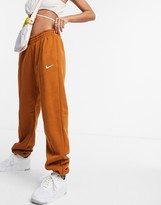 Thumbnail for your product : Nike mini swoosh oversized joggers in tawny brown