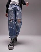 Thumbnail for your product : Topman rip and bleach relaxed jeans in mid wash