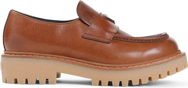 Prada Logo Plaque Round Toe Loafers